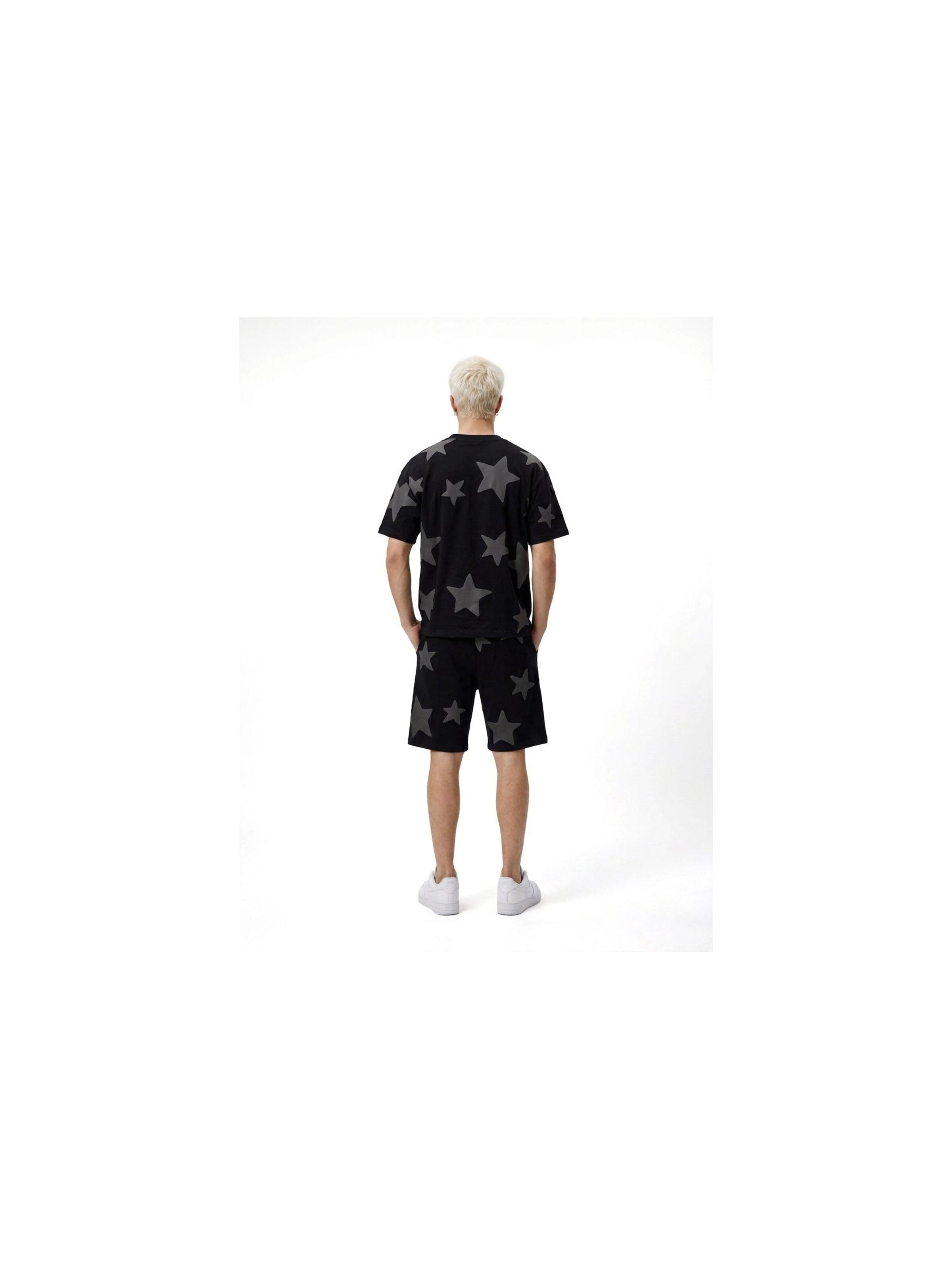 OVER STREET - Camiseta 'Camiseta negra falling stars oversized tee' en negro