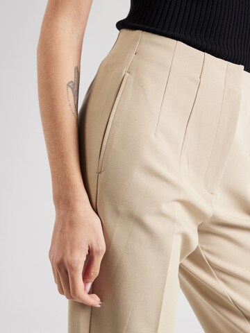 Marks & Spencer Конический (Tapered) Плиссированные брюки в Бежевый