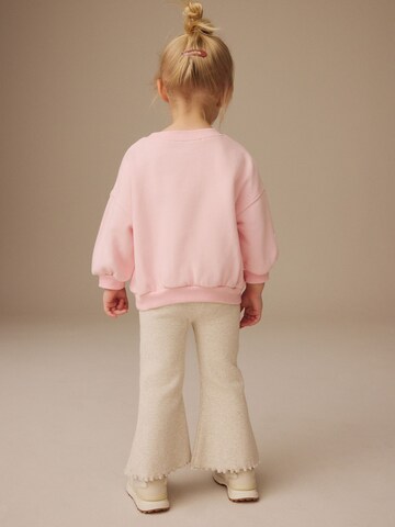 Set Next en rose