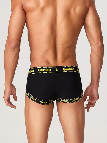 TAUWELL Boxer shorts 'Caution' in Black
