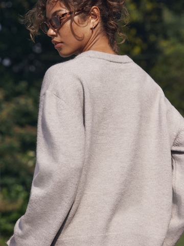 Pull-over self. en beige