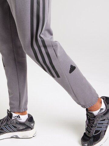 ADIDAS SPORTSWEAR Tapered Sports trousers 'Future Icons' in Grey