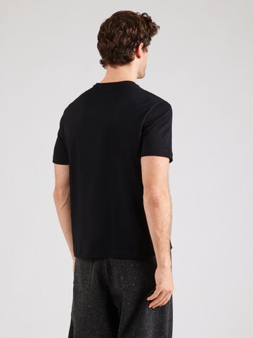 Maglietta di GUESS JEANS in nero