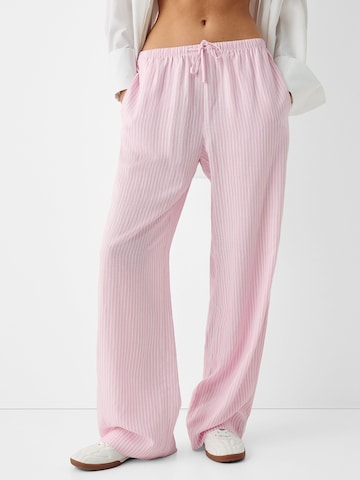 Bershka Wide leg Trousers in Pink: front
