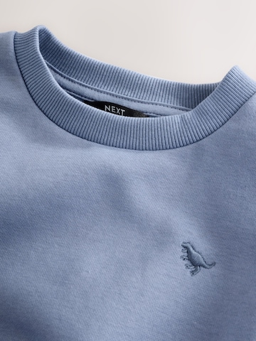 Set Next en bleu