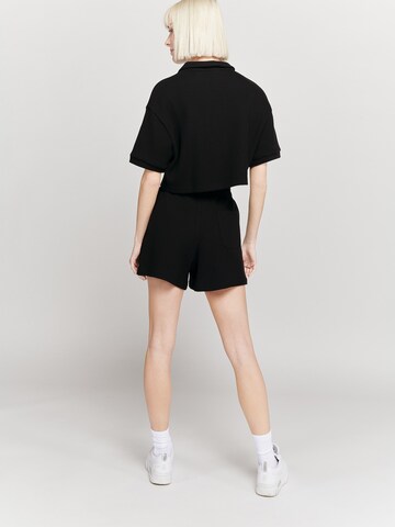 UNFOLLOWED x ABOUT YOU Regular Панталон 'EXPLORE' в черно: отзад