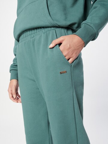 Athlecia Tapered Sportbroek 'Cinzia' in Groen