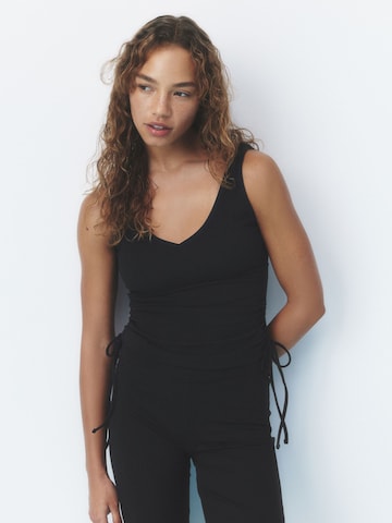 self. Top in Black: front
