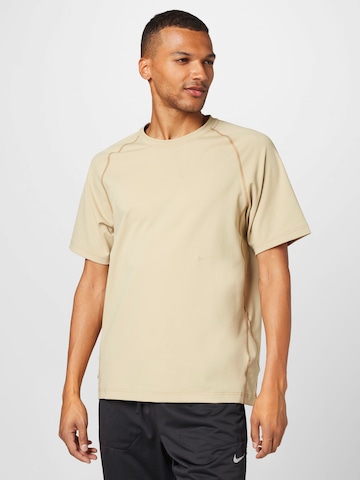 T-Shirt fonctionnel 'Axis' NIKE en beige : devant