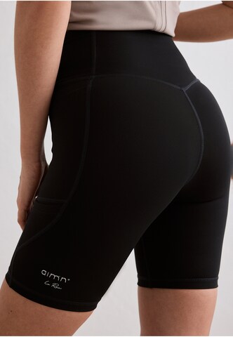 Slimfit Pantaloni sportivi di Aim'n in nero