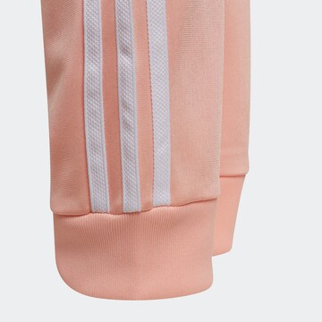 Tapered Pantaloni di ADIDAS ORIGINALS in rosa