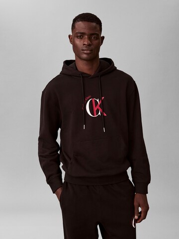 Sweat-shirt Calvin Klein Jeans en noir : devant