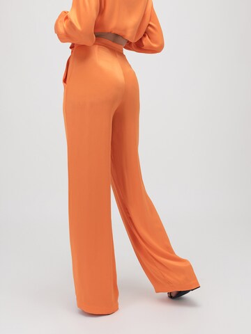 ABOUT YOU x VIAM Studio Loose fit Pants 'ELVIS' in Orange: back