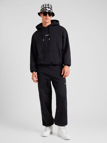 Han Kjøbenhavn Tapered Trousers 'Daily' in Black