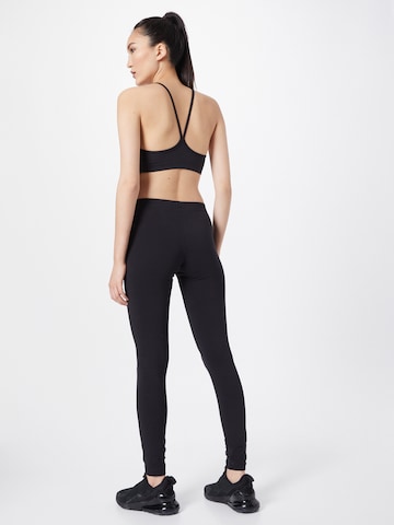 Skinny Pantalon de sport Champion Authentic Athletic Apparel en noir