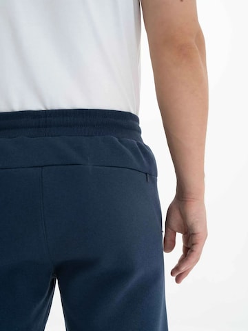 Arma Regular Trousers in Blue