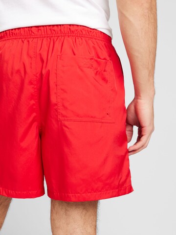 Nike Sportswear Lużny krój Spodnie 'CLUB' w kolorze czerwony