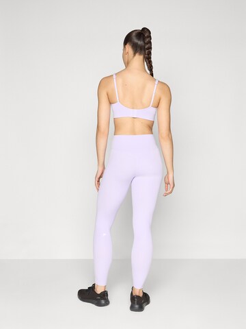 Fabletics Skinny Urheiluhousut 'PURELUXE' värissä lila
