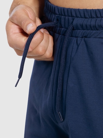 Loosefit Pantalon de sport ' Edin ' Smilodox en bleu