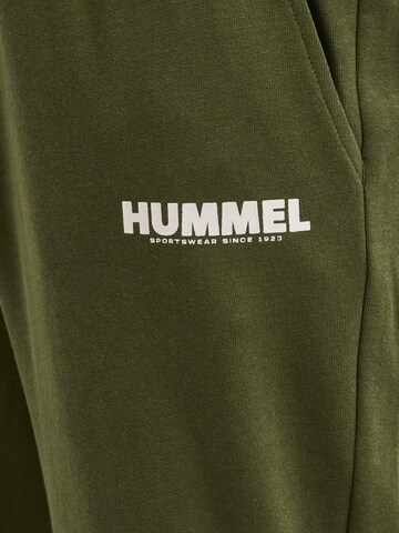 Effilé Pantalon de sport 'Legacy' Hummel en vert