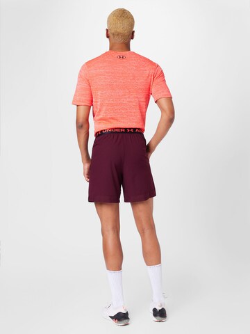 UNDER ARMOUR Normální Sportovní kalhoty 'Vanish' – červená