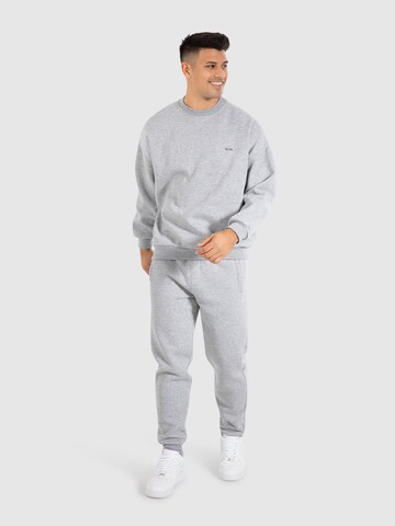 Sweat-shirt 'Kade' Smilodox en gris
