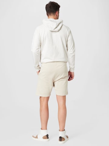 Hummel - regular Pantalón deportivo en beige