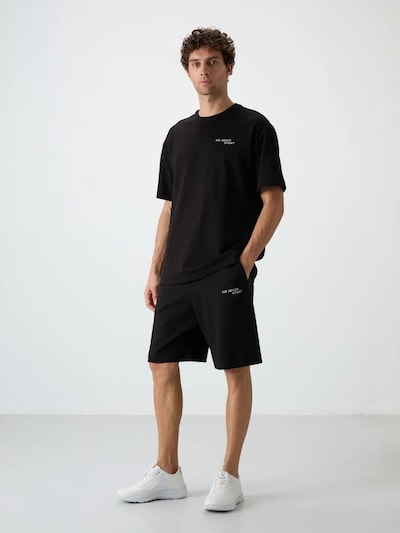 Completo sportivo in L Tommy Life di colore nero, Visualizzazione prodotti