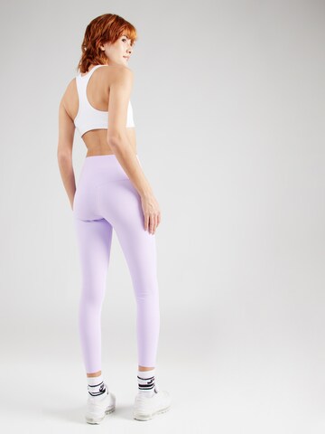 NIKE Skinny Spodnie sportowe 'UNIVERSA' w kolorze fioletowy