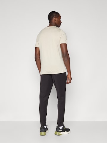 PUMA Tapered Sportbroek 'Cloudspun' in Zwart