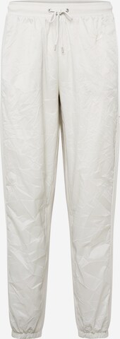 Nike Sportswear Tapered Trousers in Beige: front