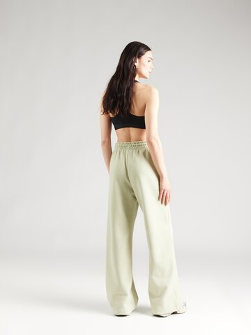 Nike Sportswear Wide leg Broek 'PHNX FLC' in Groen