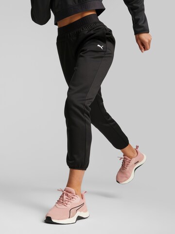 PUMA Tapered Sportbroek 'Strong Powerfleece' in Zwart: voorkant