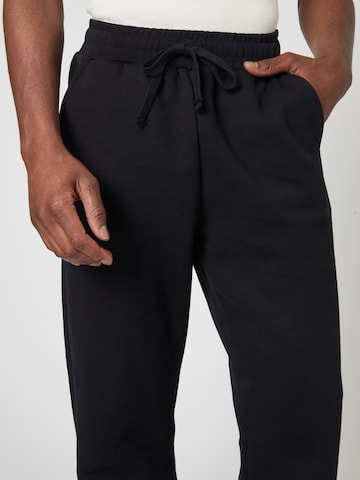 ABOUT YOU x Louis Darcis Loosefit Hose in Schwarz