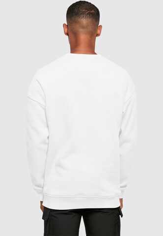 Sweat-shirt 'Stay Safe' Merchcode en blanc