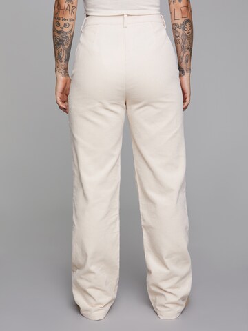 ABOUT YOU x Sharlota Flared Trousers 'Mona' in Beige