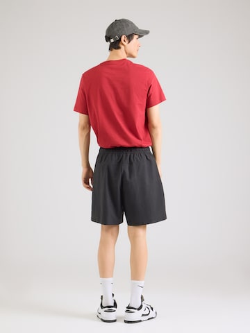 juoda Nike Sportswear Laisvas Kelnės