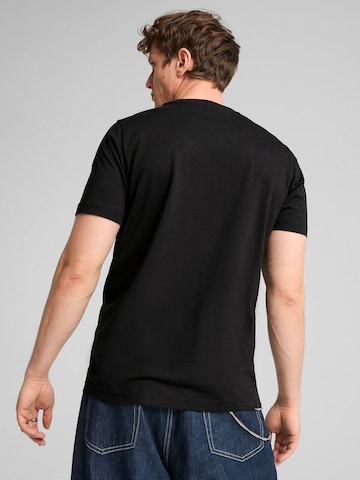 PUMA - Camiseta 'Puma Graphics Wording Tee' en negro