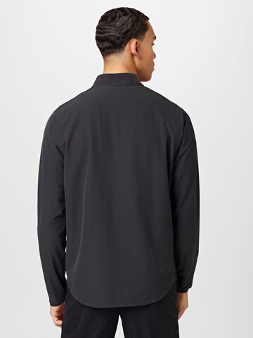 NIKE - Chaqueta de chándal en negro