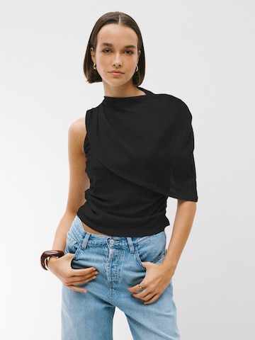 Next - Top en negro: frente