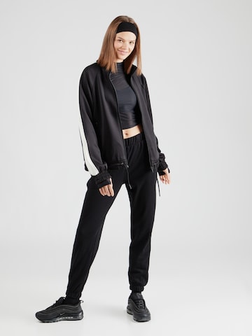 Effilé Pantalon de sport 4F en noir