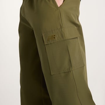 new balance - Loosefit Pantalón cargo en verde