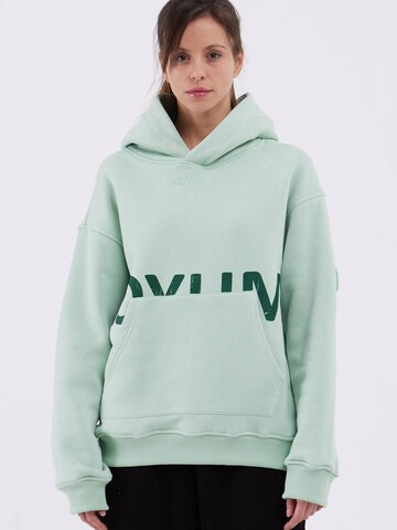 Koyumi Sweatshirt 'Unisex Oversize Hoodie – 3-Faden Stoff, innen angeraut Suheyla Love it' in Grün