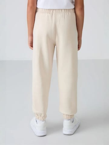 Tommy Life Broek 'TOMMY Kinder Jogginghose' in Beige