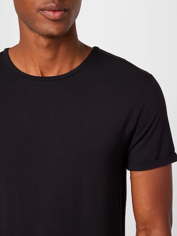 CURARE Yogawear Funkční tričko 'Flow' – černá