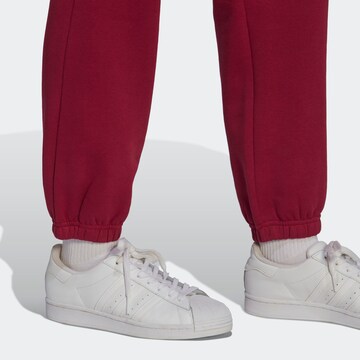 ADIDAS ORIGINALS Tapered Trousers 'Adicolor Essentials Fleece' in Red