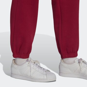 ADIDAS ORIGINALS Tapered Pants 'Adicolor Essentials Fleece' in Red