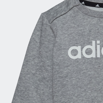 ADIDAS SPORTSWEAR Trainingsanzug 'Essentials Lineage' in Grau