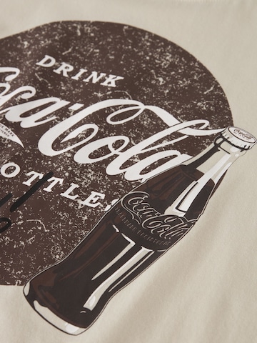 TWO SOON - Camiseta 'Coca Cola' en beige