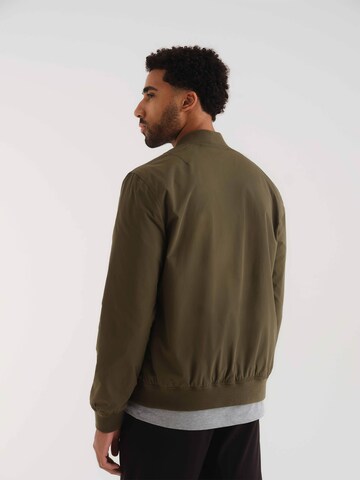 ABOUT YOU x Kevin Trapp Between-season jacket 'Robin' in Green